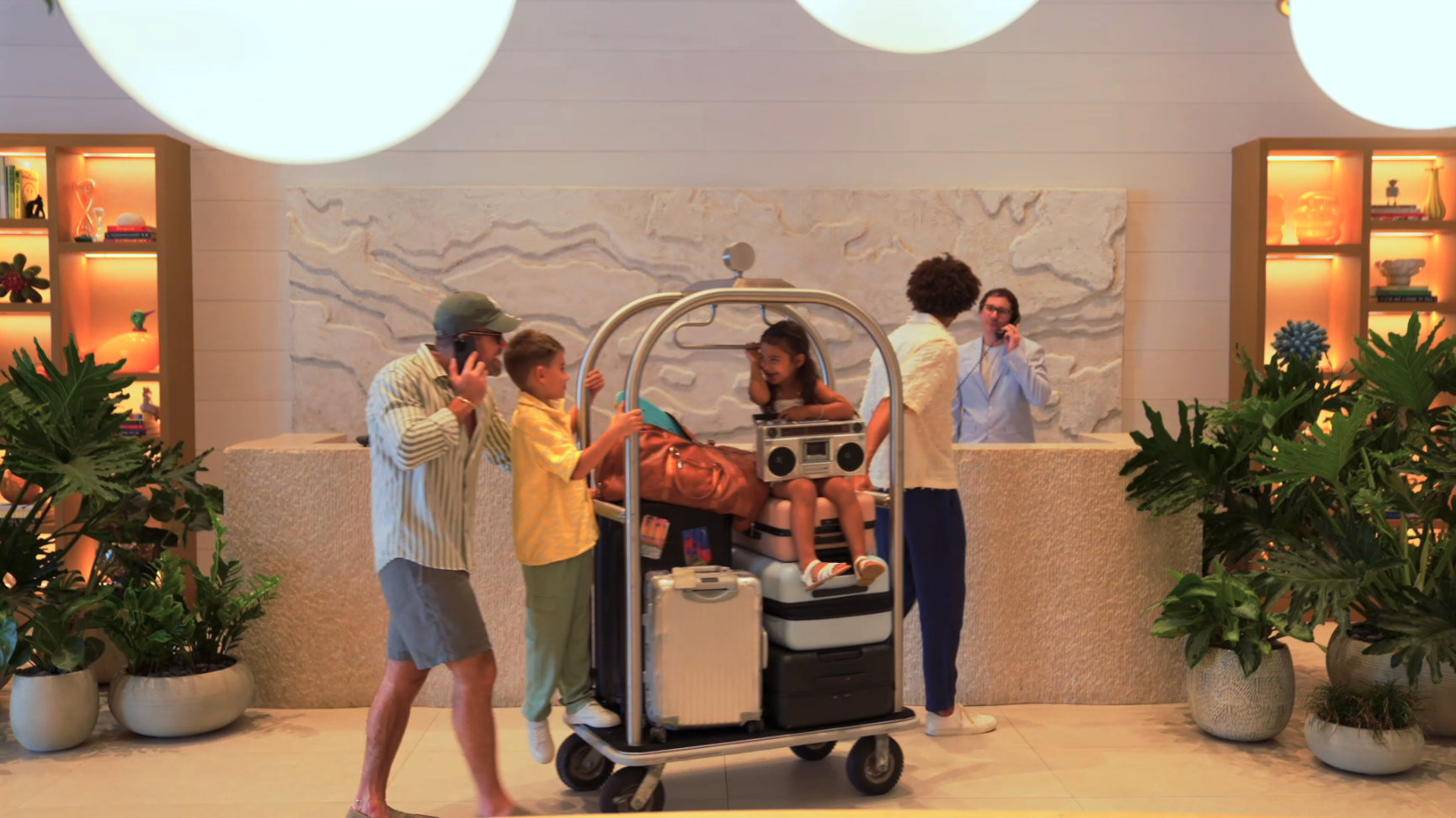 Family checking in with baggage on luggage cart